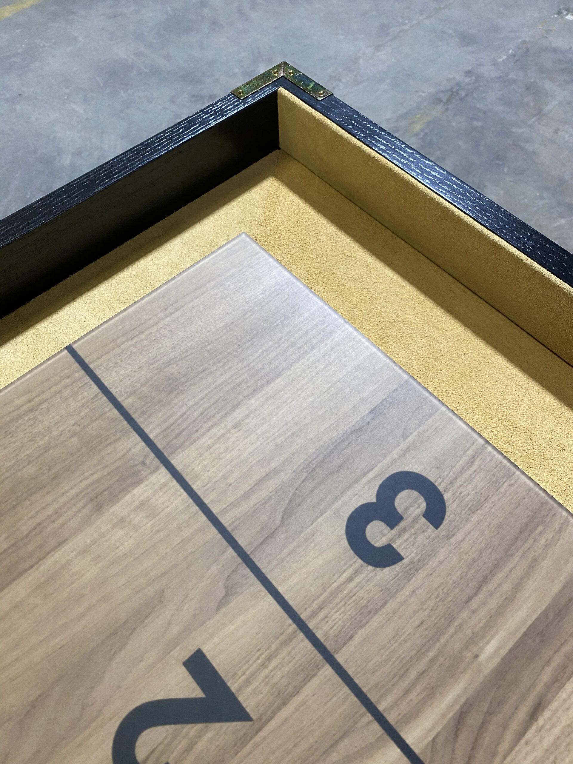 Corner of Blackened Oak frame, Walnut playing surface, Tan suede, Yellow Zinc hardware Corner of Blackened Oak frame, Walnut playing surface, Tan suede, Yellow Zinc hardware